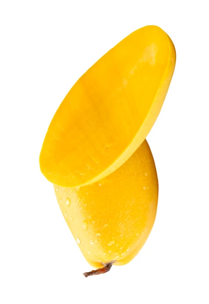 Fresh ripe yellow mango with a slice on white background