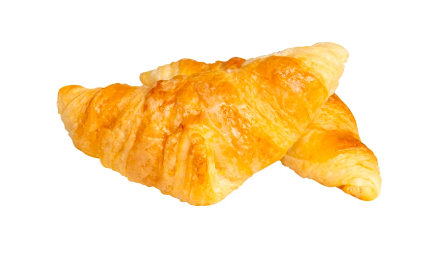 Two fresh golden croissants isolated on a white background