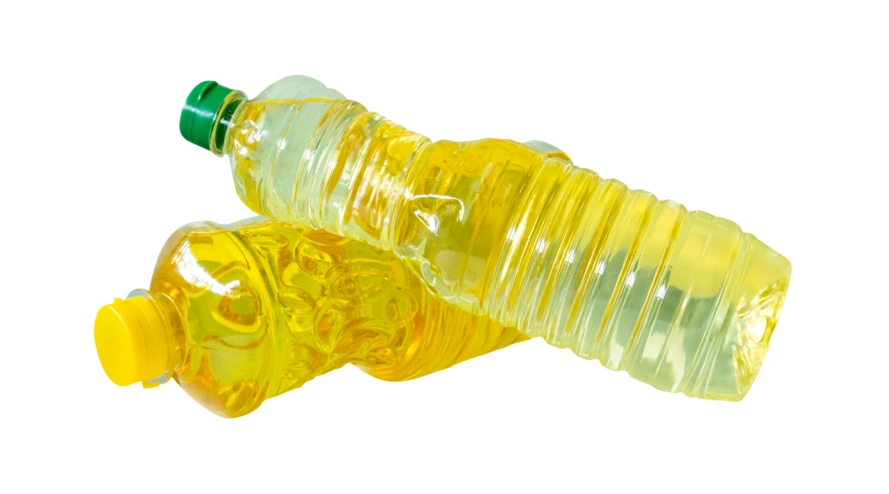 Two plastic bottles of cooking oil isolated on white