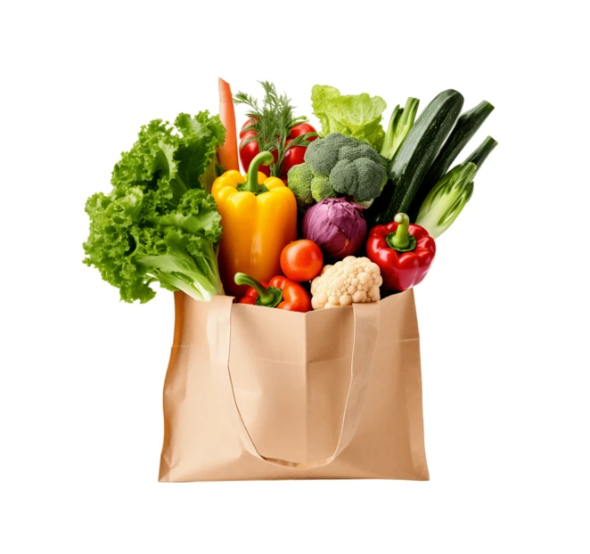 Reusable grocery bag filled with fresh organic vegetables isolated on white