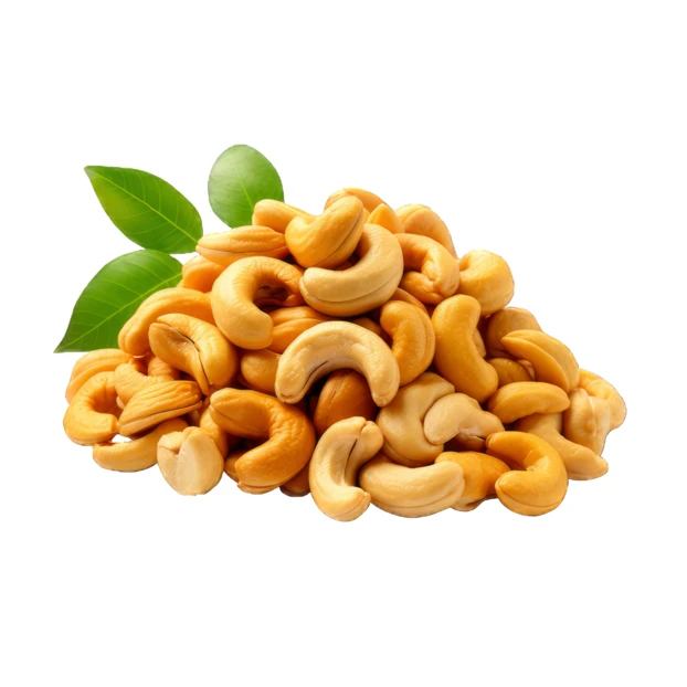 Roasted cashew nuts with green leaves isolated on white background