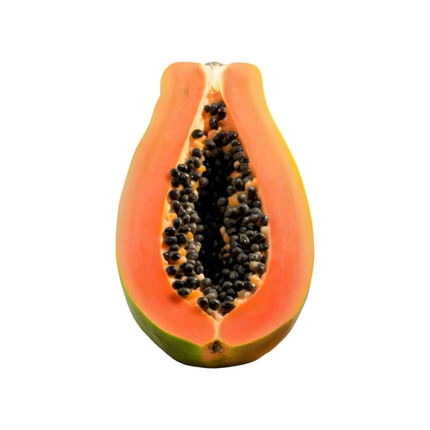 Half of a ripe papaya with seeds on white background