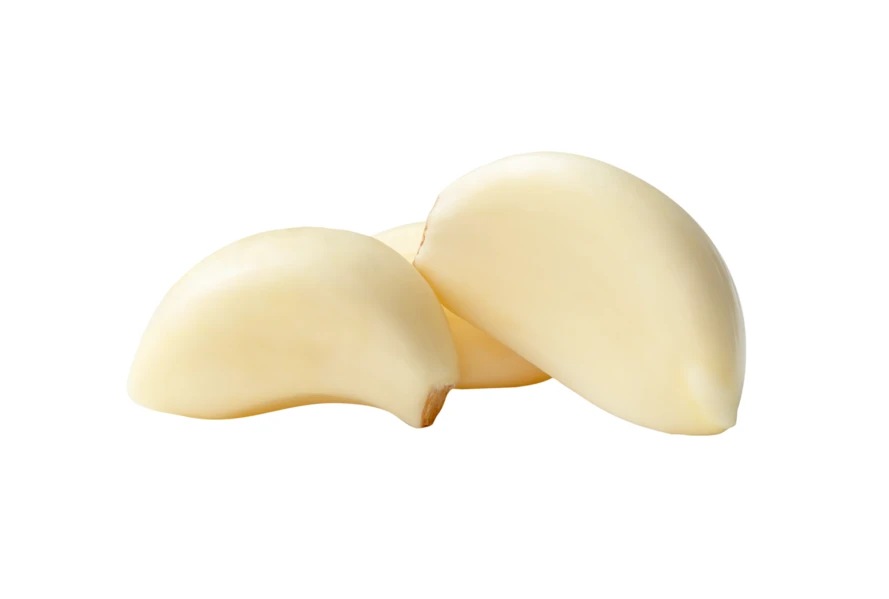 Peeled garlic cloves isolated on white background
