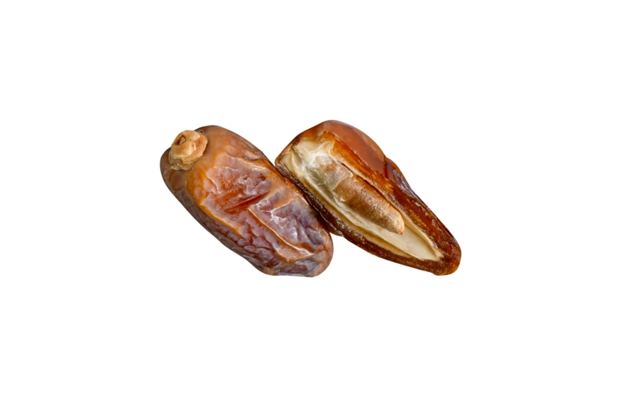 Two dried date palm fruits one split showing the pit