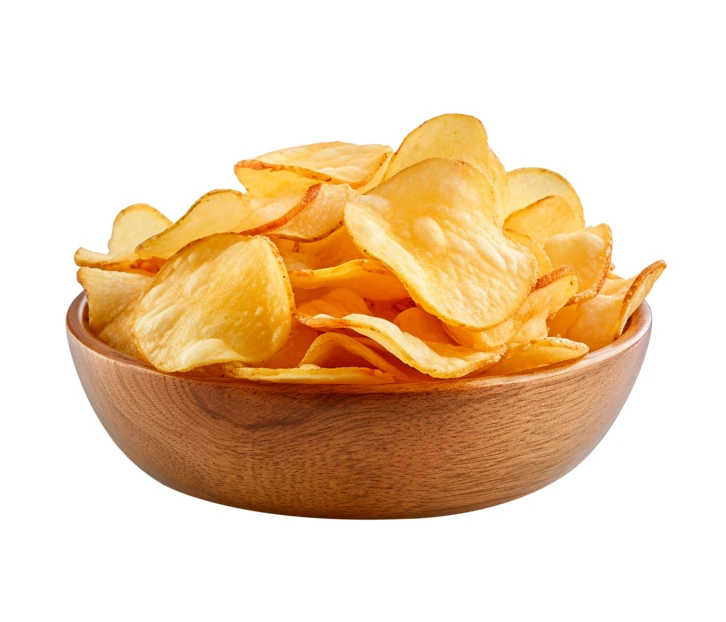 Crispy golden potato chips in a wooden bowl