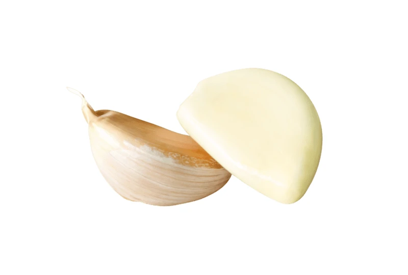Two garlic cloves isolated on a white background