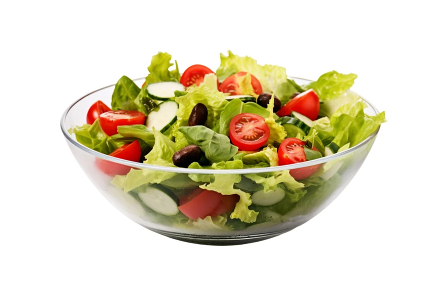 Fresh garden salad with tomatoes and cucumbers in glass bowl