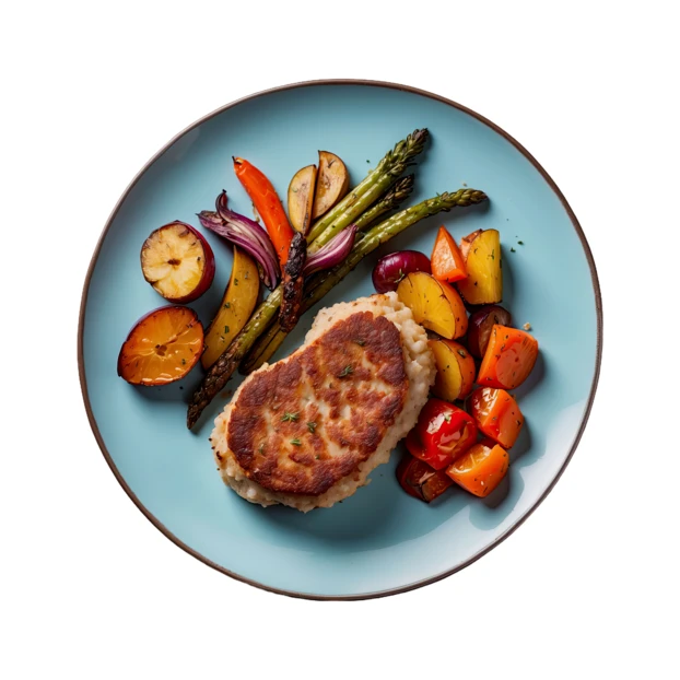 Pan-seared meat cutlet with roasted asparagus and vegetables