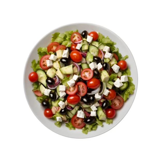 Fresh Greek salad with feta, olives, and tomatoes on white