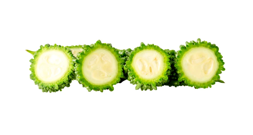 Fresh bitter gourd slices isolated on white background