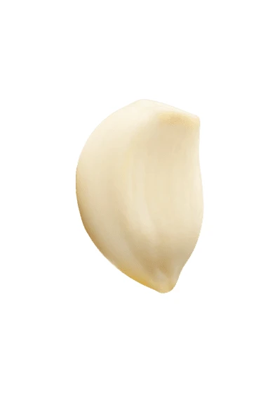 Single peeled garlic clove isolated on white background