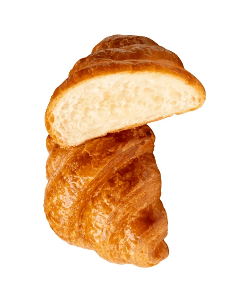 Fresh golden croissant cut in half isolated on white background