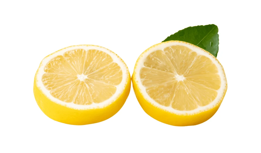 Two fresh lemon halves with a green leaf isolated