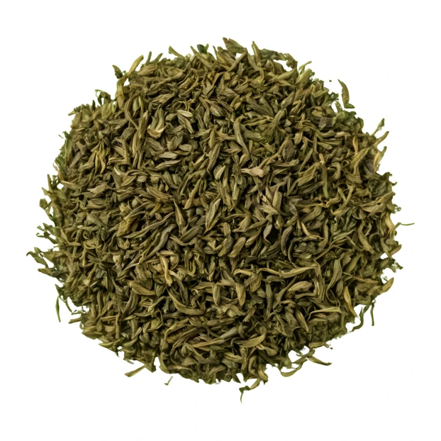 Pile of dried loose leaf green tea isolated on white