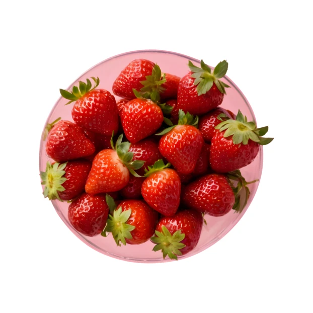 Top view of a pink bowl filled with fresh strawberries