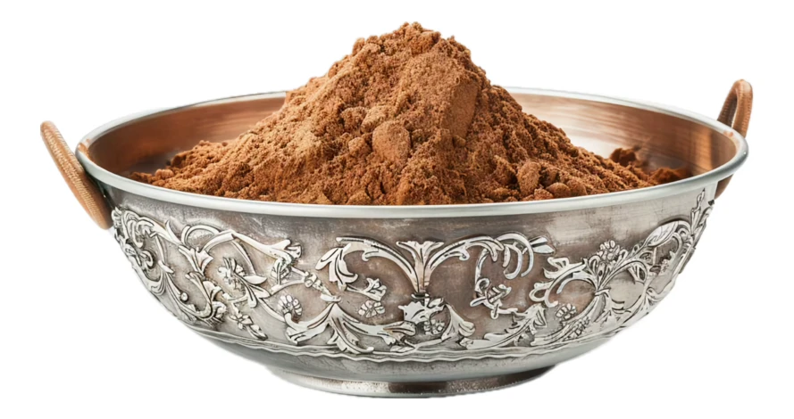 Cocoa powder in a decorative silver bowl isolated on white