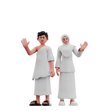 A couple in white prayer robes waving