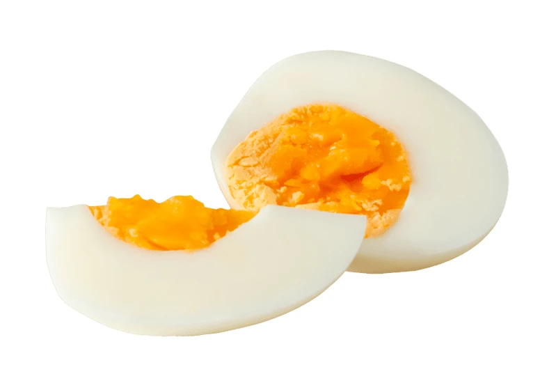 Hard-boiled egg half and slice isolated on white