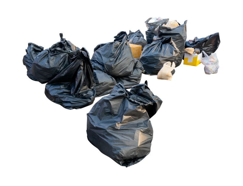 Group of black plastic garbage bags isolated on white background