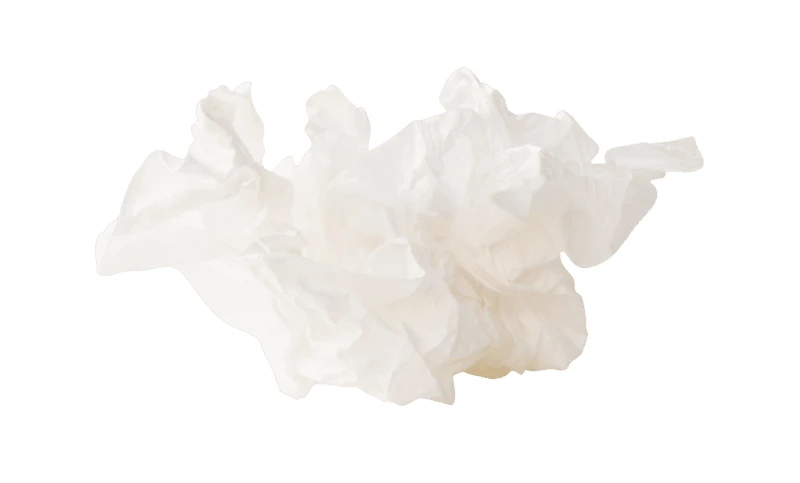 Single crumpled white facial tissue isolated on white background