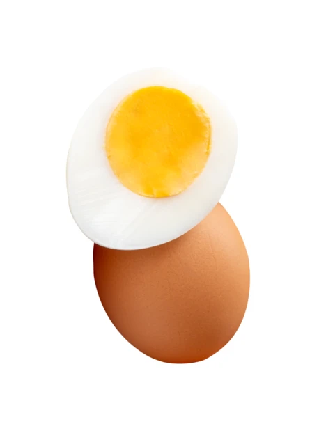 Hard-boiled egg half on top of whole brown egg