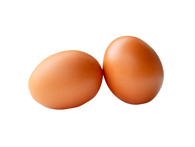 Two brown chicken eggs isolated on white background