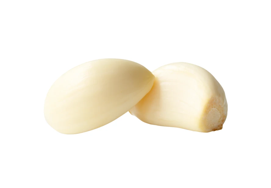 Two peeled garlic cloves isolated on white background