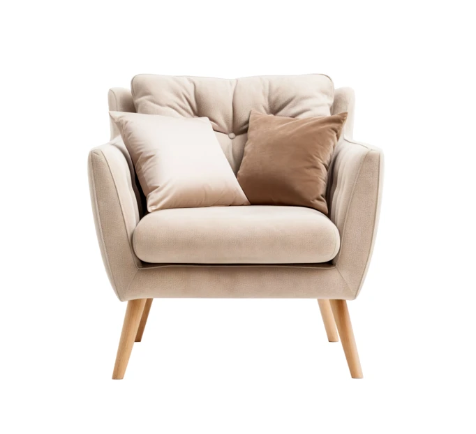 Modern beige velvet armchair with pillows isolated on white