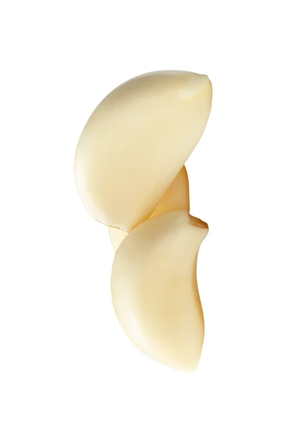 Peeled garlic cloves isolated on white background