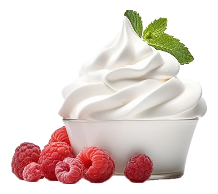 Swirled whipped cream in glass bowl with raspberries and mint