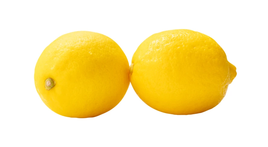 Two whole yellow lemons isolated on white background