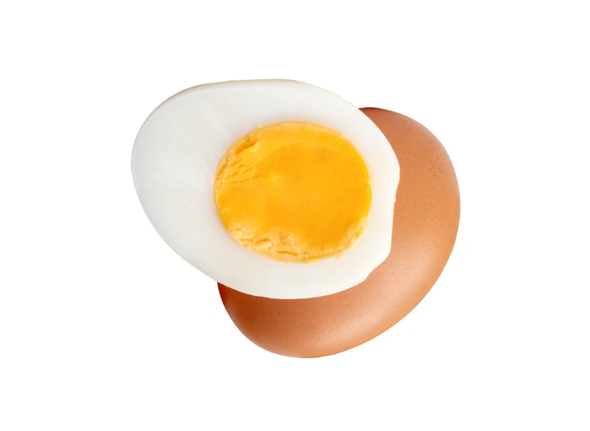 Hard boiled egg and whole brown egg isolated on white
