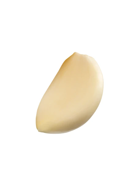 Single peeled garlic clove isolated on white background