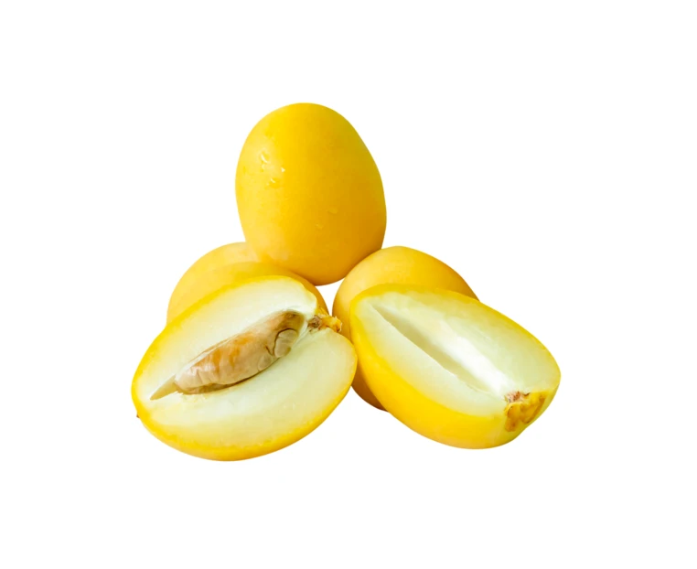 Fresh ripe marian plums isolated on white background