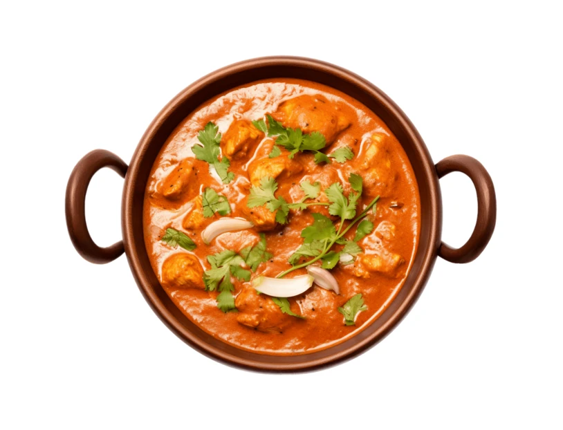 Indian butter chicken curry in a traditional bowl isolated