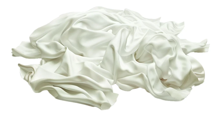 Crumpled pile of white satin fabric on white background