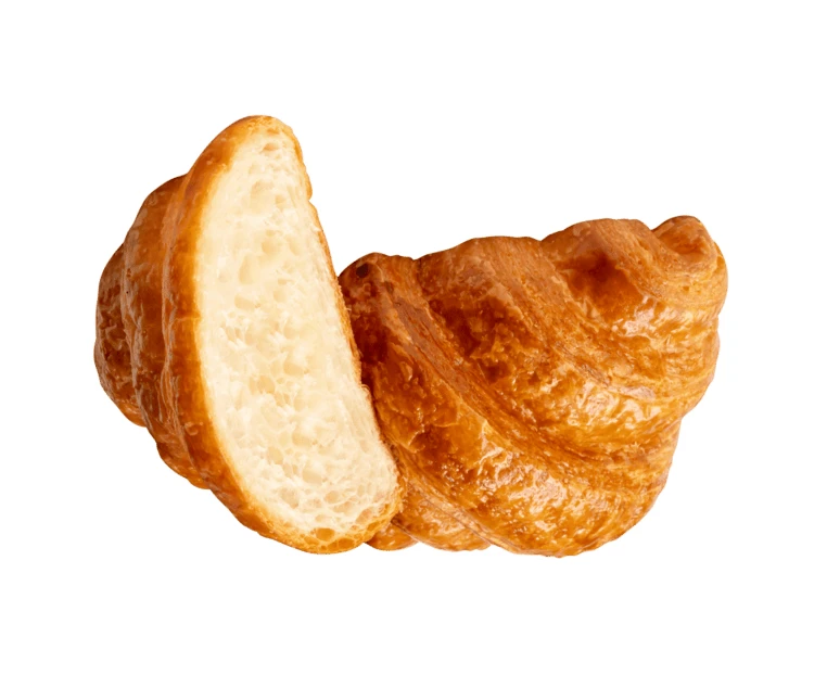 Freshly baked croissant cut in half on white background
