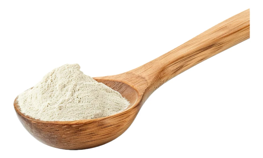 Wooden spoon filled with light colored powder on white background
