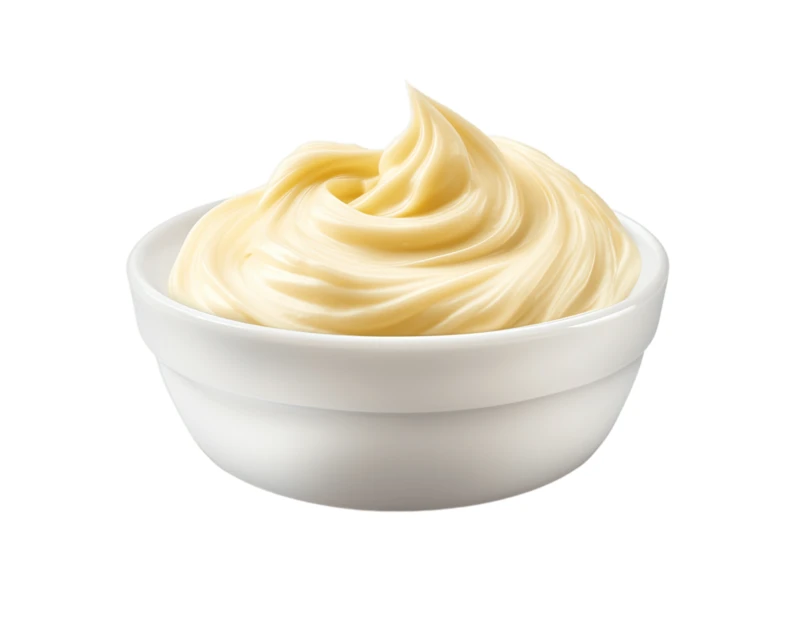 Bowl of creamy mayonnaise swirl isolated on white