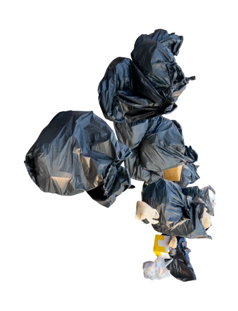 Pile of black plastic garbage bags isolated on white