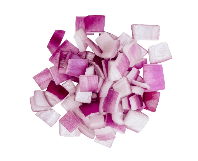 Top view of diced red onion pieces on white background