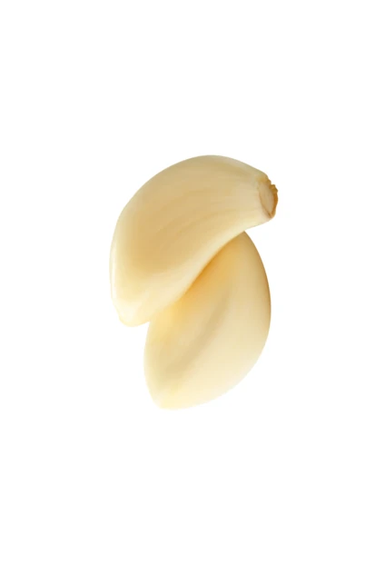Two peeled garlic cloves isolated on white background