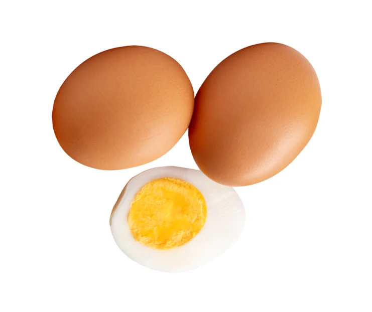 Two brown eggs and one hard-boiled egg half