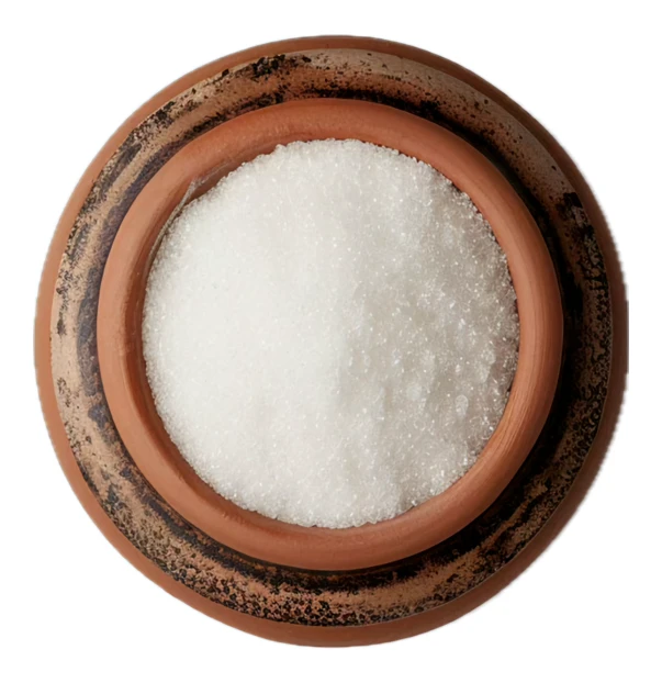Top view of white salt in a rustic clay bowl
