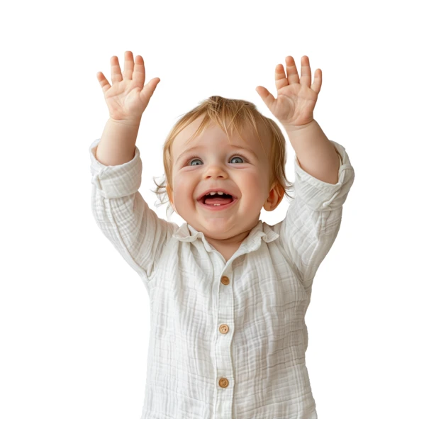 Excited baby boy laughing with hands in the air