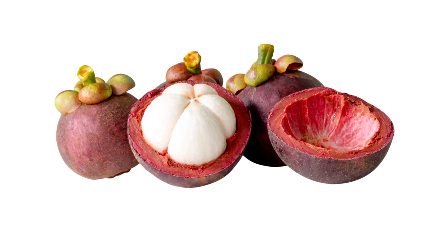 Fresh mangosteen fruits whole and halved on white background
