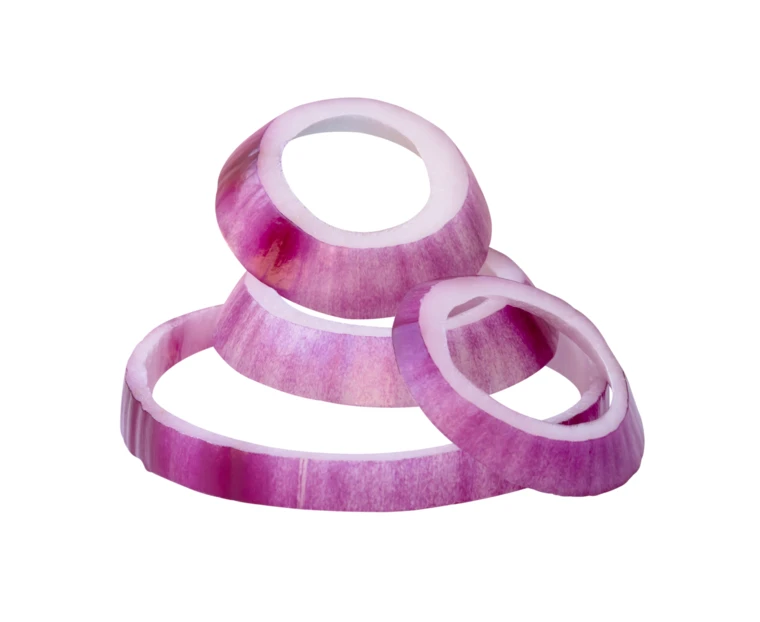 Slices of red onion rings isolated on white background