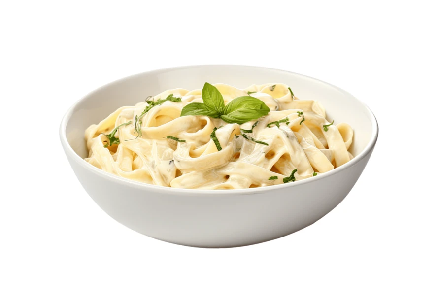 Bowl of creamy fettuccine alfredo pasta with basil garnish