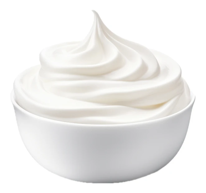 Swirl of creamy whipped cream in a white bowl