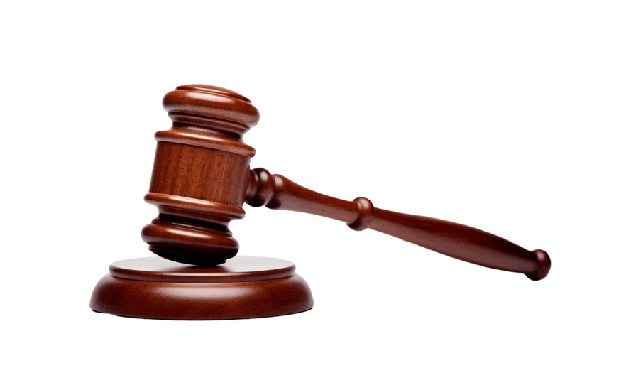 Wooden judge's gavel and block isolated on white background